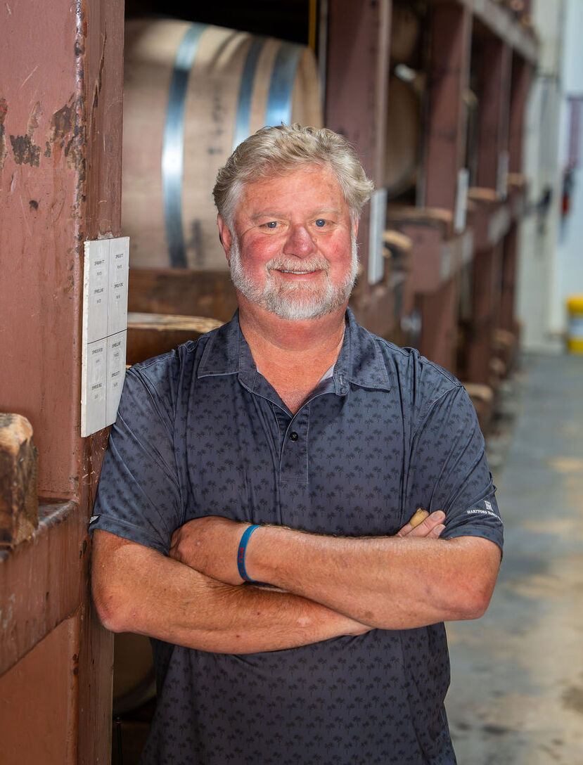 Jeff Stewart standing in a vineyard